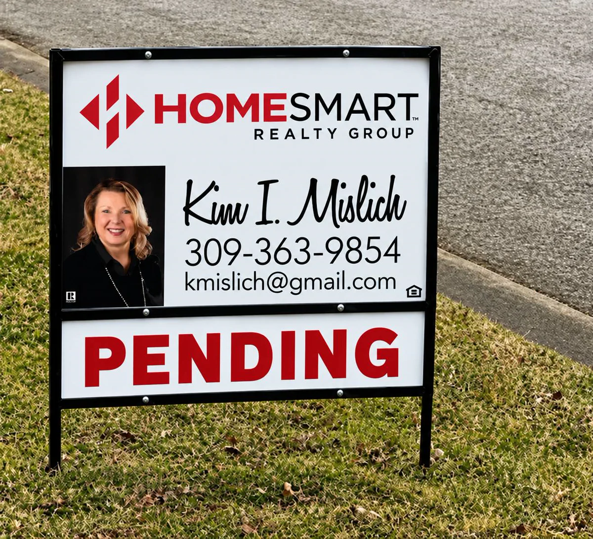 HomeSmart Realty Group yard sign for Kim I. Mislich with a PENDING rider